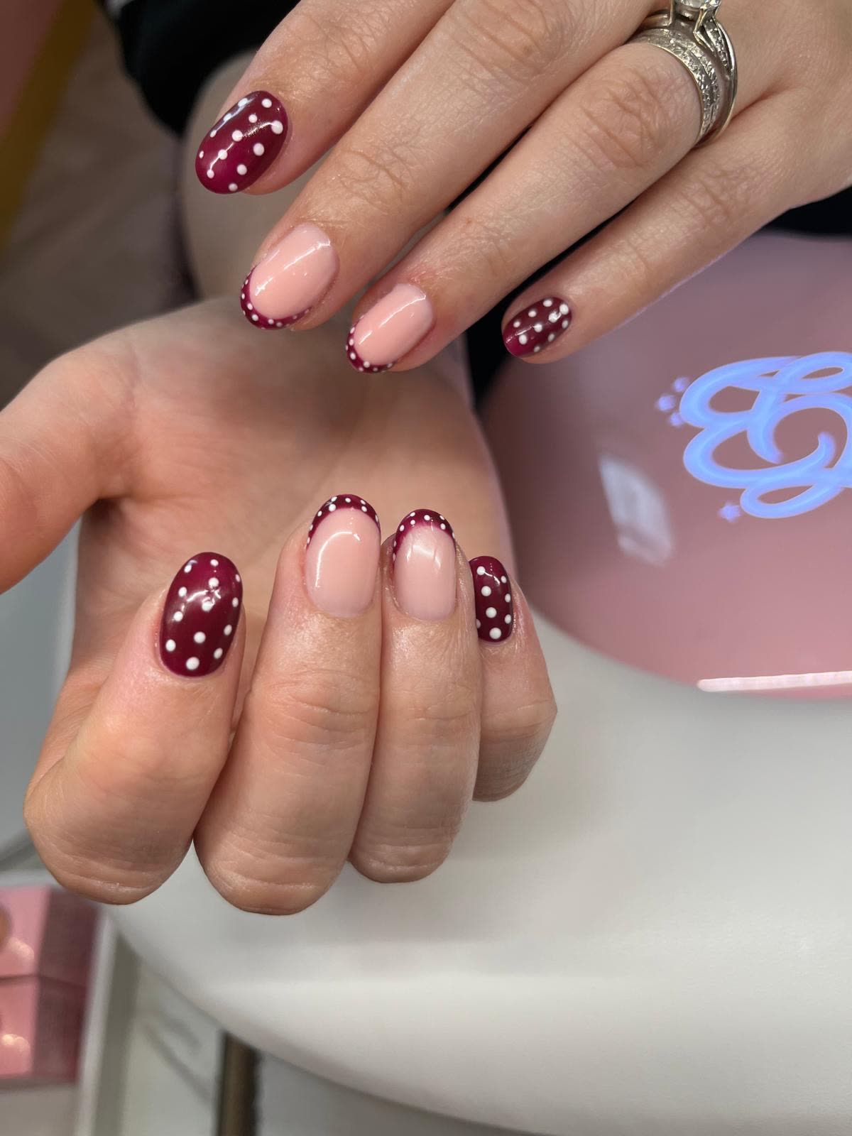 Burgundy nail art with white dots