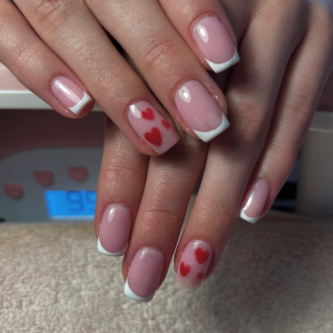White French with heart nail art